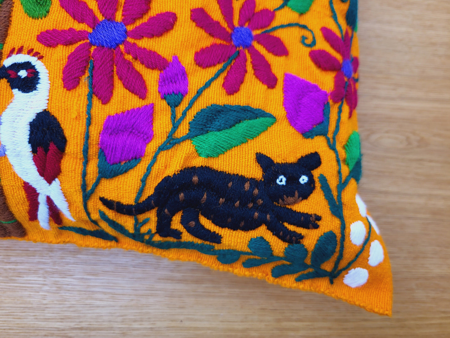 Animal print cushion, hand embroidered and woven in Mexico by indigenous women