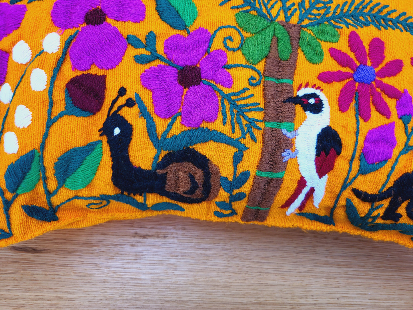 Animal print cushion, hand embroidered and woven in Mexico by indigenous women