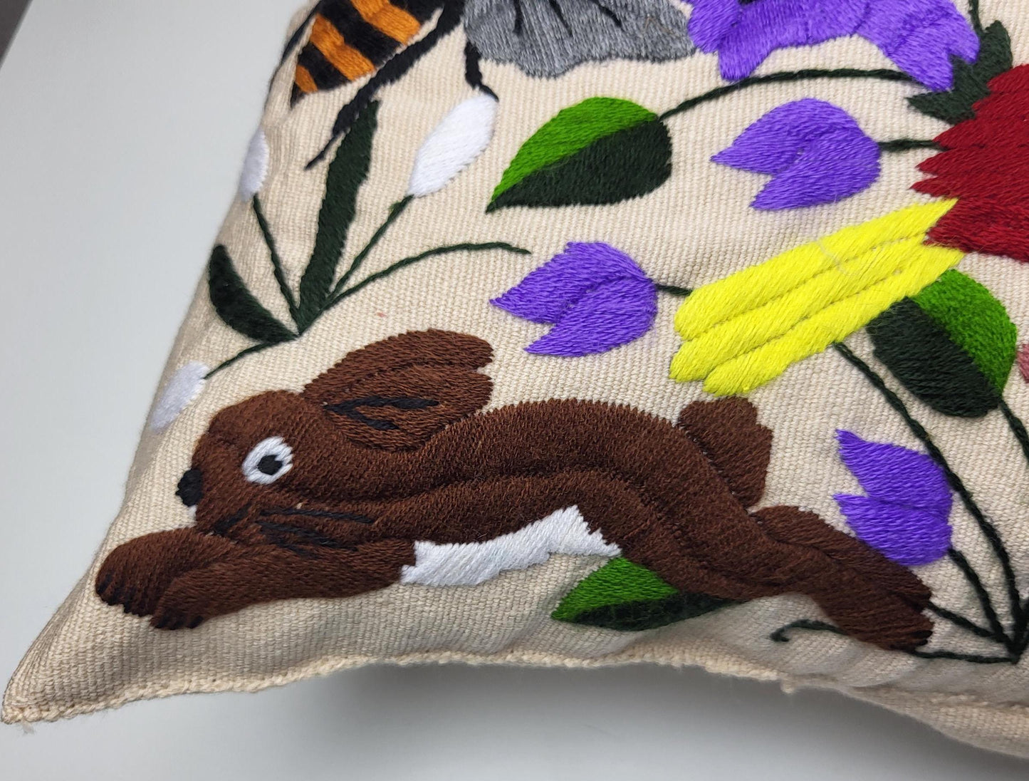 Hand-embroidered and woven Mexican cushion cover with animal pattern β Unique handicrafts from Mexico