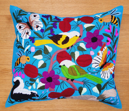  Blue decorative pillow with a colorful bird pattern, showcasing vibrant hues and intricate embroidery