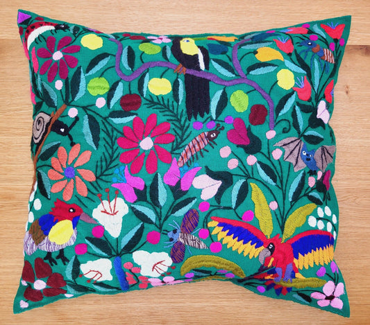 green decorative pillow from Fairmex, showcasing a colorful bird pattern with intricate embroidery and vibrant hues