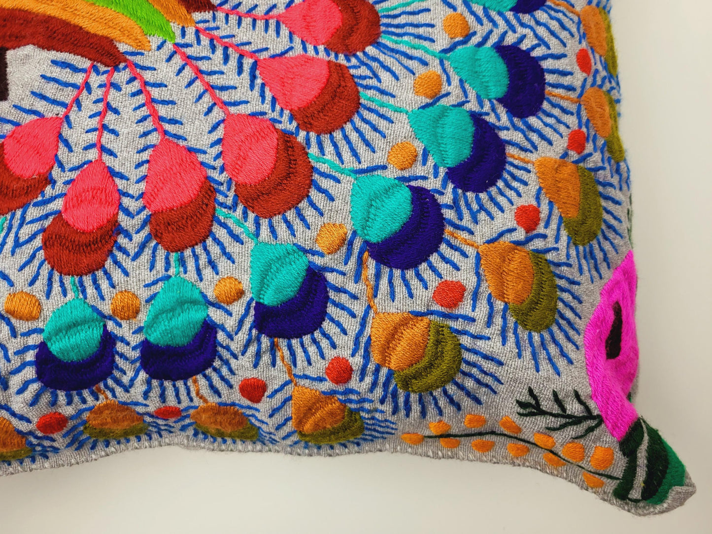 Handmade cushion cover from Mexico – artfully embroidered and woven with an enchanting animal motif.