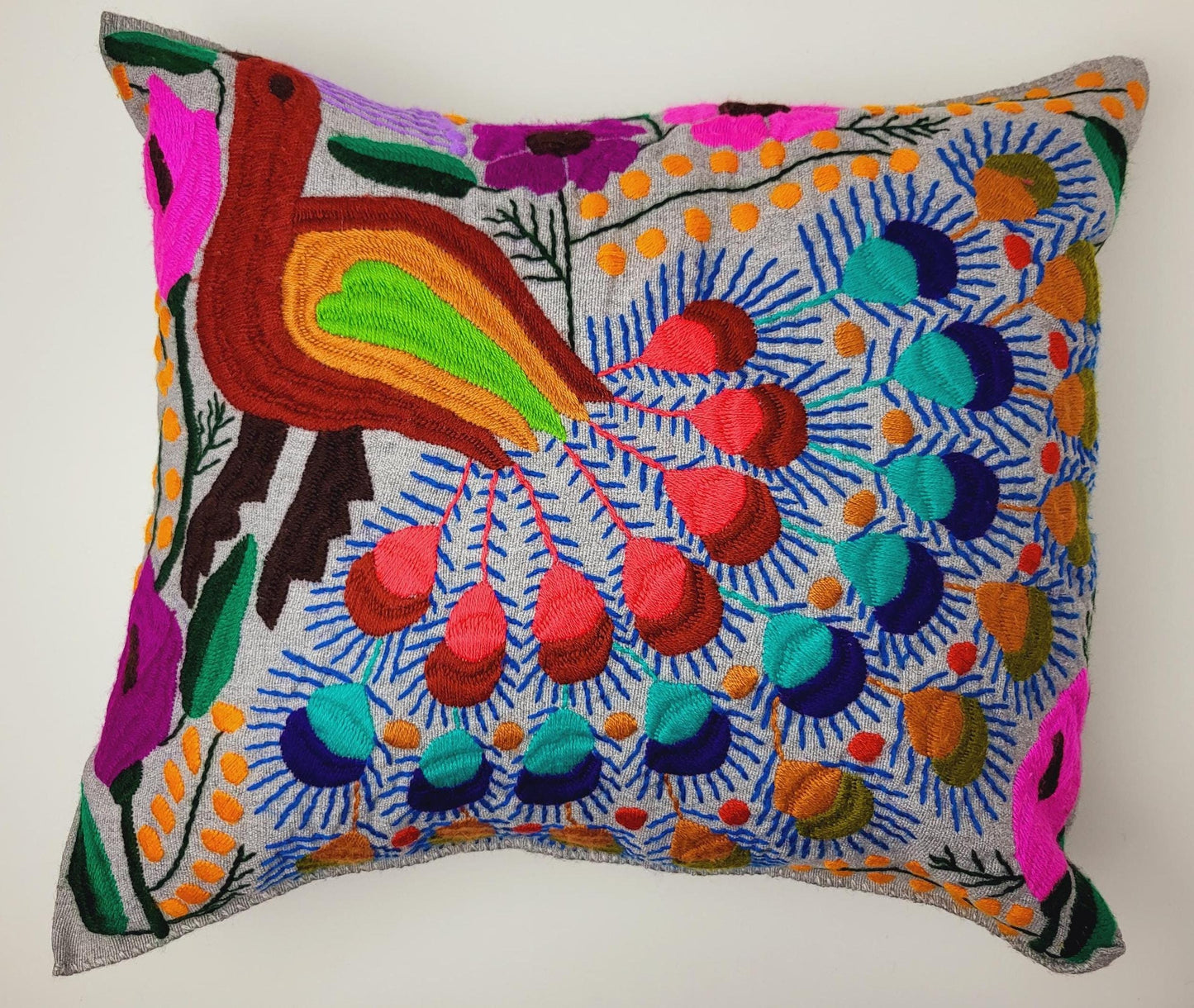 Handmade cushion cover from Mexico – artfully embroidered and woven with an enchanting animal motif.