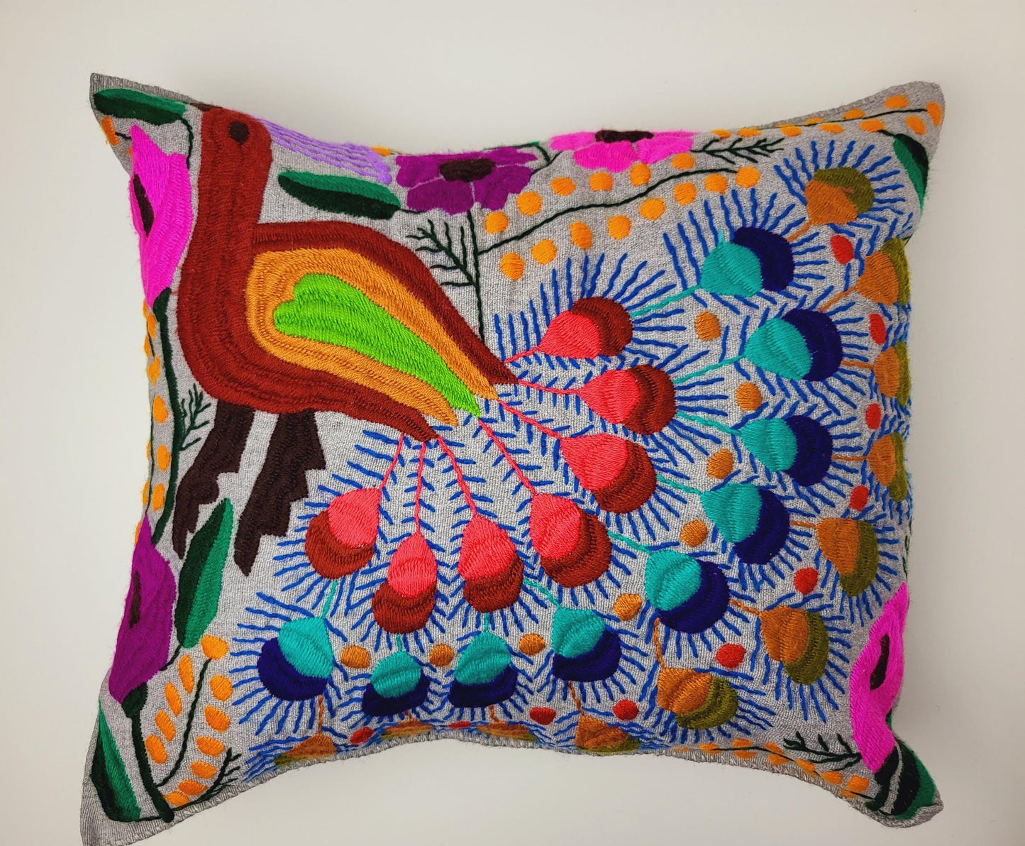 Handmade cushion cover from Mexico – artfully embroidered and woven with an enchanting animal motif.